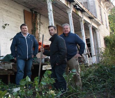 Mitch Winston and his brokers Christian Lipp, left, and Scott Strough, right, surveyed the property at 6 Union Street in Sag Harbor for the first time yesterday since Mr. Winston and a partner closed on their purchase of the house. Mitch Winston and his brokers Christian Lipp, left, and Scott Strough, right, surveyed the property at 6 Union Street in Sag Harbor for the first time yesterday since Mr. Winston and a partner closed on their purchase of the house.