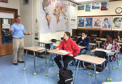 John Reilly, a Bridgehampton School teacher, has dedicated much classroom time to discussing the presidential election with his students, including, from left, Max Cheng, Raymond Maldonado, and Nia Dawson. John Reilly, a Bridgehampton School teacher, has dedicated much classroom time to discussing the presidential election with his students, including, from left, Max Cheng, Raymond Maldonado, and Nia Dawson.