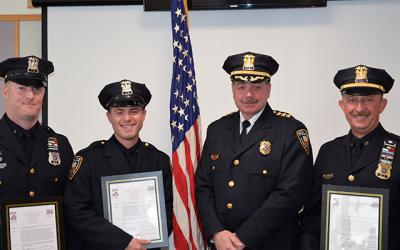 Chief Gerard Larsen, second from right, congratulated officers who helped save the life of a man who collapsed at the Maidstone Club in September, from left, Officer Matt Kochanasz, Officer Steven Niggles, and Sgt. Richard Mamay. Chief Gerard Larsen, second from right, congratulated officers who helped save the life of a man who collapsed at the Maidstone Club in September, from left, Officer Matt Kochanasz, Officer Steven Niggles, and Sgt. Richard Mamay.
