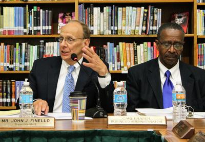 John J. Finello, left, will stay on as Springs School superintendent for the time being, as a school board search for a permanent replacement goes on.