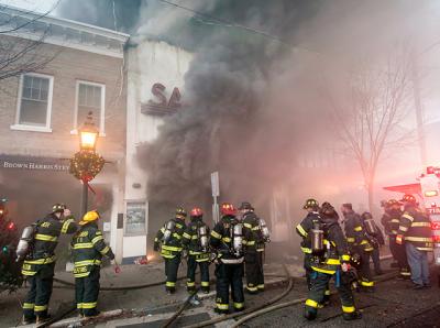 Smoke billowed from the doors of the Sag Harbor Cinema early Friday morning as firefighters worked to control a blaze that damaged or destroyed six buildings. Smoke billowed from the doors of the Sag Harbor Cinema early Friday morning as firefighters worked to control a blaze that damaged or destroyed six buildings.