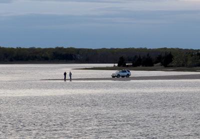 Two fishermen took a pause from casting to talk at Gerard Point on Monday evening. Reports were that big bluefish have been landed there and at other bay beaches since Saturday.
