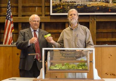 Tom Ruhle of East Hampton Town’s Office of Housing and Community Development and the Rev. Steven Howarth pulled “winning tickets” during a home ownership lottery drawing on May 31 at East Hampton Town Hall. Tom Ruhle of East Hampton Town’s Office of Housing and Community Development and the Rev. Steven Howarth pulled “winning tickets” during a home ownership lottery drawing on May 31 at East Hampton Town Hall.