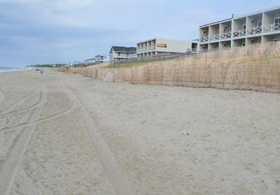 Retreat from the downtown Montauk shore, with the oceanfront row of motels moved back to fill in gaps on the next street up and dunes taking their place, is among the recommendations in a draft plan for the hamlet. Retreat from the downtown Montauk shore, with the oceanfront row of motels moved back to fill in gaps on the next street up and dunes taking their place, is among the recommendations in a draft plan for the hamlet.