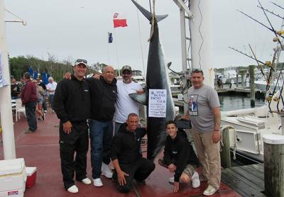 The crew of the Gotta’ Go posed with their 453-pound mako, the winning fish in the Star Island Yacht Club’s shark tournament last weekend. The crew of the Gotta’ Go posed with their 453-pound mako, the winning fish in the Star Island Yacht Club’s shark tournament last weekend.