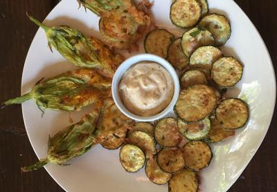 It’s not too early for locally grown zucchini blossoms, at least from the greenhouse. Peanut oil can take the heat required for high-temperature frying without burning. It’s not too early for locally grown zucchini blossoms, at least from the greenhouse. Peanut oil can take the heat required for high-temperature frying without burning.