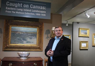 Terry Wallace greeted visitors at the opening reception on Friday for “Caught on Canvas: Views of Eastern Long Island Landscapes From the Wallace Collection, 1850-1935,” a show of a portion of his holdings through July 23 at the Clinton Academy. Terry Wallace greeted visitors at the opening reception on Friday for “Caught on Canvas: Views of Eastern Long Island Landscapes From the Wallace Collection, 1850-1935,” a show of a portion of his holdings through July 23 at the Clinton Academy.