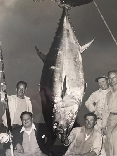 Capt. Frank Tuma Sr., kneeling at lower right, with a giant bluefin tuna caught aboard a charter fishing trip out of Montauk.