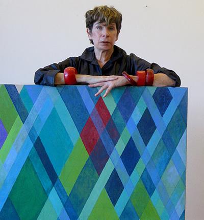 Arlene Slavin with one of the works from her “Intersections” series Arlene Slavin with one of the works from her “Intersections” series