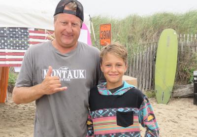 Craig Lieder congratulated his son, Chase, on getting first place in menehune short board contest and two third-place finishes in boys long board and open long board at the Rell Sunn Surf Contest at Ditch Plain Beach on Sunday. Craig Lieder congratulated his son, Chase, on getting first place in menehune short board contest and two third-place finishes in boys long board and open long board at the Rell Sunn Surf Contest at Ditch Plain Beach on Sunday.