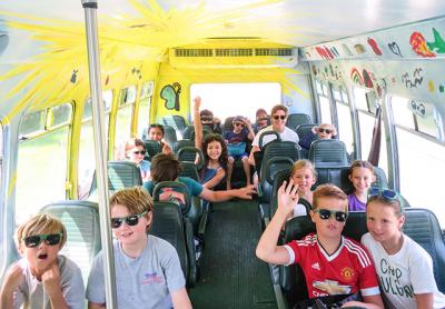 A brightly painted bus transports Camp SoulGrow kids all over the East End for free activities connecting campers with businesses and community groups.