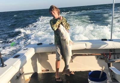 Bennett Burki, 14, caught a 35-pound striped bass on the charter boat Hurry Up off Montauk on Monday. Peter Burki Bennett Burki, 14, caught a 35-pound striped bass on the charter boat Hurry Up off Montauk on Monday. Peter Burki