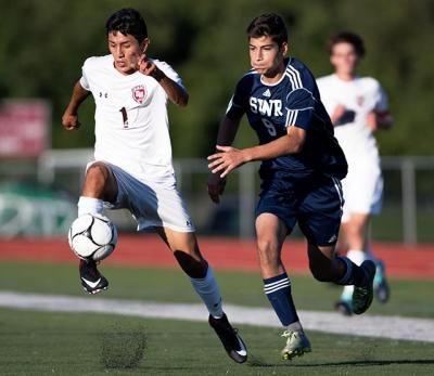 Marco Gutama (number 1) scored two goals for East Hampton’s 3-1 win in the rain here over Miller Place on Sept. 19. Marco Gutama (number 1) scored two goals for East Hampton’s 3-1 win in the rain here over Miller Place on Sept. 19.