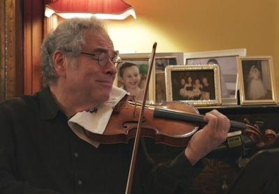 Itzhak Perlman in a scene from “Itzhak,” a documentary having its world premiere as the opening night film of the Hamptons International Film Festival. Itzhak Perlman in a scene from “Itzhak,” a documentary having its world premiere as the opening night film of the Hamptons International Film Festival.