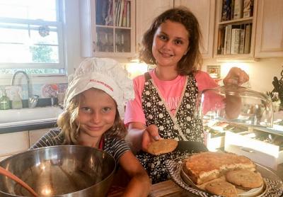 Beatrice Flight donned a chef’s hat while her older sister, Scarlett, supervised as the two prepared for a bake sale at the Montauk School to help Houston’s Fonwood Early Childhood Center recover from Hurricane Harvey. Beatrice Flight donned a chef’s hat while her older sister, Scarlett, supervised as the two prepared for a bake sale at the Montauk School to help Houston’s Fonwood Early Childhood Center recover from Hurricane Harvey.