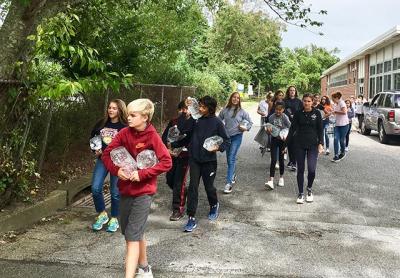 Learning by doing, East Hampton’s seventh graders experienced the arduous task of carrying water from the middle school to the high school and back, which tied in to the subject of a book they are reading in class as well as a film project they are working on in conjunction with the Hamptons International Film Festival. Learning by doing, East Hampton’s seventh graders experienced the arduous task of carrying water from the middle school to the high school and back, which tied in to the subject of a book they are reading in class as well as a film project they are working on in conjunction with the Hamptons International Film Festival.
