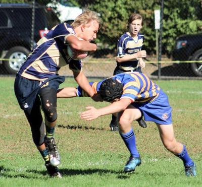 Kevin Bunce Jr., an East Hampton High School freshman, fended off a tackler in last weekend’s jayvee 7s tournament in Pelham, N.Y. Kevin Bunce Jr., an East Hampton High School freshman, fended off a tackler in last weekend’s jayvee 7s tournament in Pelham, N.Y.