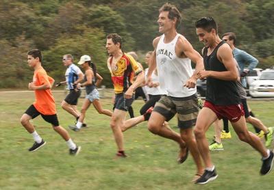 From the right, Omar Leon, Paul Hamilton, Chris Daily (the eventual winner), Beth Feit, Joe Amato, and Graeme Olsen (in the lead) sprinted across Ed Ecker County Park’s meadow at the start of Sunday’s Serpent’s Back Duathlon. From the right, Omar Leon, Paul Hamilton, Chris Daily (the eventual winner), Beth Feit, Joe Amato, and Graeme Olsen (in the lead) sprinted across Ed Ecker County Park’s meadow at the start of Sunday’s Serpent’s Back Duathlon.