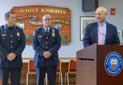 With words of praise from East Hampton Village Police Chief Michael Tracey, center, and Richard Lawler, right, a village board member who is also the village police commissioner, Steven Sheades was promoted on Friday to the rank of sergeant. With words of praise from East Hampton Village Police Chief Michael Tracey, center, and Richard Lawler, right, a village board member who is also the village police commissioner, Steven Sheades was promoted on Friday to the rank of sergeant.