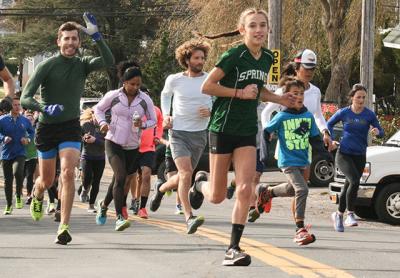 Isabella Tarbet, facing the camera above, an East Hampton High School ninth grader and cross-country standout, was first among the Dock Race’s female contestants. Isabella Tarbet, facing the camera above, an East Hampton High School ninth grader and cross-country standout, was first among the Dock Race’s female contestants.
