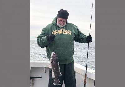 Al Daniels held a six-pound blackfish taken at Fishers Island on Sunday. Al Daniels held a six-pound blackfish taken at Fishers Island on Sunday.