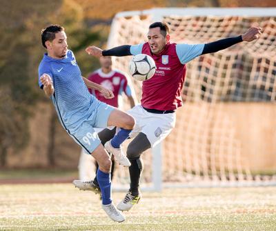 Luis Barrera, at right, scored what proved to be Hampton United’s clinching goal early in the second half of Sunday’s showdown with Charruas 1950 at Hampton Bays High School. Luis Barrera, at right, scored what proved to be Hampton United’s clinching goal early in the second half of Sunday’s showdown with Charruas 1950 at Hampton Bays High School.
