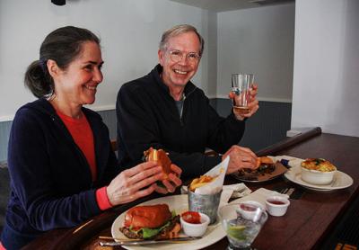 Cynthia and John Kaufmann sampled a pulled pork slider and a veggie burger at the Springs Tavern. Cynthia and John Kaufmann sampled a pulled pork slider and a veggie burger at the Springs Tavern.