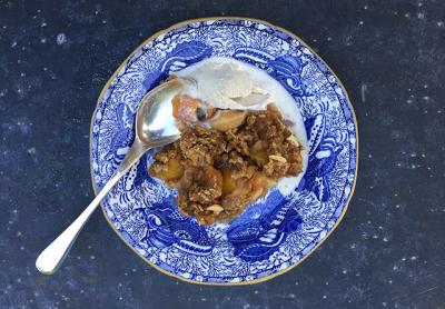 A fruit crisp, this one featuring peaches and apples, can be lightened up with less sugar and fat and still taste delicious.