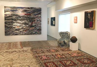 Moroccan rugs and, from left, Jayson Musson’s “Mass Shadow Generator,” a South African Zulu pot, Hank Willis Thomas’s “D Block,” and Sterling Ruby’s “D.C.” at the Rental Gallery Moroccan rugs and, from left, Jayson Musson’s “Mass Shadow Generator,” a South African Zulu pot, Hank Willis Thomas’s “D Block,” and Sterling Ruby’s “D.C.” at the Rental Gallery