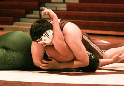 Albert Darchiev, shown pinning his Harborfields opponent above, preserved East Hampton’s 42-39 win at West Babylon by keeping his match close at 285. Albert Darchiev, shown pinning his Harborfields opponent above, preserved East Hampton’s 42-39 win at West Babylon by keeping his match close at 285.