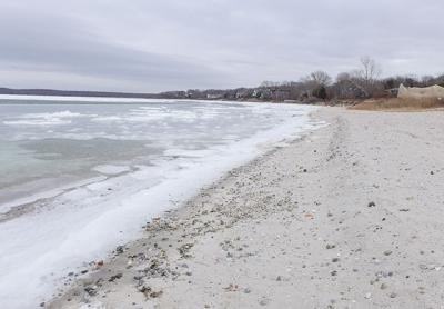 Havens Beach in Sag Harbor was on the receiving end of a harbor dredging project in the fall that left gray silt and more rocks than usual on the sand. Village officials have said they will remove as many of the rocks as possible. Havens Beach in Sag Harbor was on the receiving end of a harbor dredging project in the fall that left gray silt and more rocks than usual on the sand. Village officials have said they will remove as many of the rocks as possible.