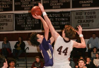 Chris Stoecker, East Hampton's tallest player at 6 feet 7 inches, was a force underneath in the Jan. 23 game here with Islip. Chris Stoecker, East Hampton's tallest player at 6 feet 7 inches, was a force underneath in the Jan. 23 game here with Islip.