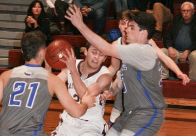Bonac’s Jack Reese fought through traffic in the early going of the Jan. 31 boys basketball game here with Hauppauge. Even though he sat for most of the fourth quarter, the versatile senior point guard finished with 23 points in the 76-55 win. Bonac’s Jack Reese fought through traffic in the early going of the Jan. 31 boys basketball game here with Hauppauge. Even though he sat for most of the fourth quarter, the versatile senior point guard finished with 23 points in the 76-55 win.