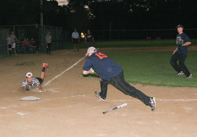 Back in the summer of 2012, CfAR’s Tommy Thorsen scored on a Joe Sullivan single in an East Hampton Town men’s slow-pitch softball league best-of-five final against Schenck Fuels at the Terry King ball field in Amagansett. Back in the summer of 2012, CfAR’s Tommy Thorsen scored on a Joe Sullivan single in an East Hampton Town men’s slow-pitch softball league best-of-five final against Schenck Fuels at the Terry King ball field in Amagansett.