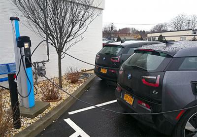 A sign of things to come: Electric cars fueled up at parking meter-style electric pumps at the Southampton BMW dealership. A sign of things to come: Electric cars fueled up at parking meter-style electric pumps at the Southampton BMW dealership.