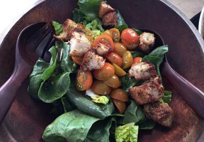 A salad of spinach, romaine, cherry tomatoes, and homemade croutons is a great transitional dish from winter to spring. A salad of spinach, romaine, cherry tomatoes, and homemade croutons is a great transitional dish from winter to spring.