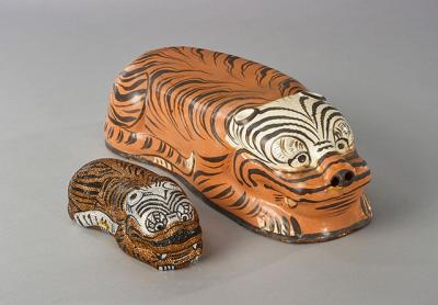 Objects from the Leibers’ collection of Chinese ceramics include a tiger-form pillow with tiger handbag. Objects from the Leibers’ collection of Chinese ceramics include a tiger-form pillow with tiger handbag.