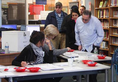 Voters lined up on Tuesday to cast their ballots on a $16.9 million bond that will allow the Springs School to undertake a major expansion and renovation project.