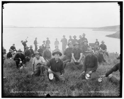 Members of the 5th Army Corps posed for a photograph in Montauk, with supperware in hand.