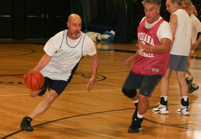 Rich Hand, driving with the ball, was effectively resurrected a few years ago by Doc Katz, far right, Claude Beudert, near right, and Charlie Bateman.