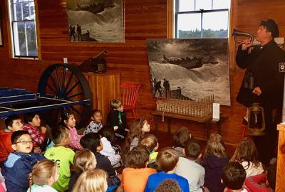 History was brought to life at the Amagansett Life-Saving and Coast Guard Station on Atlantic Avenue as third graders from the John M. Marshall Elementary School watched their teacher, David Cataletto, re-enact the challenging life and times of Coast Guardsmen stationed there in the early 1900s. History was brought to life at the Amagansett Life-Saving and Coast Guard Station on Atlantic Avenue as third graders from the John M. Marshall Elementary School watched their teacher, David Cataletto, re-enact the challenging life and times of Coast Guardsmen stationed there in the early 1900s.