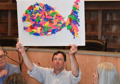 Rick Drew of the East Hampton Town Trustees held aloft a “balloon fish” made by his colleague Susan McGraw Keber. Rick Drew of the East Hampton Town Trustees held aloft a “balloon fish” made by his colleague Susan McGraw Keber.