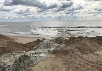 Georgica Pond was opened to the Atlantic Ocean on Monday, flushing it of toxins and increasing salinity. Georgica Pond was opened to the Atlantic Ocean on Monday, flushing it of toxins and increasing salinity.