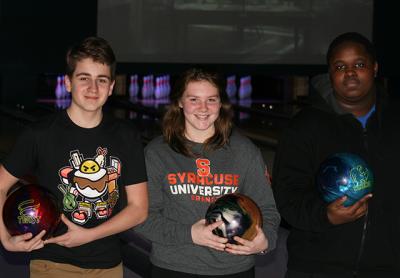 Samantha Schurr, a senior, is the team’s number-one; Matt Rosario, left, and Sy Webb, right, are numbers two and three.