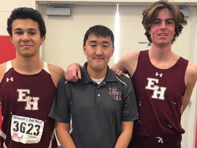 Ryan Fowkes, at right, and Matt Maya after the county’s small schools meet Sunday with their coach, Ben Turnbull.