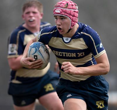 Kevin Bunce Jr., with the ball above, would have competed in his first international rugby tournament in Orlando, Fla., this weekend if he hadn’t suffered a broken collarbone in Sunday’s game with Rockaway.