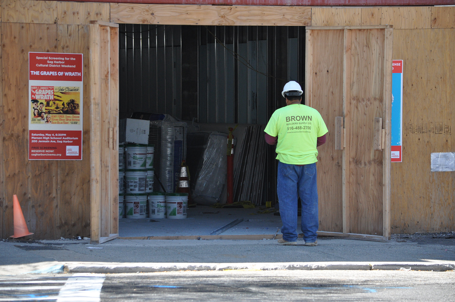 A worker paused for a moment of fresh air outside the Sag Harbor Cinema restoration yesterday. About $4 million in additional funding is needed to complete a planned film arts center there. A worker paused for a moment of fresh air outside the Sag Harbor Cinema restoration yesterday. About $4 million in additional funding is needed to complete a planned film arts center there.