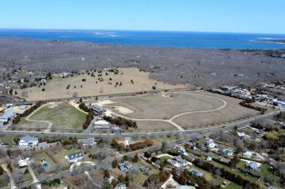 The East Hampton Housing Authority has purchased 4.7 acres east of the I.G.A. in Amagansett, at left in the photo above, for a 40-unit housing complex, sparking concern among residents about the effect on their taxes and their school. The East Hampton Housing Authority has purchased 4.7 acres east of the I.G.A. in Amagansett, at left in the photo above, for a 40-unit housing complex, sparking concern among residents about the effect on their taxes and their school.