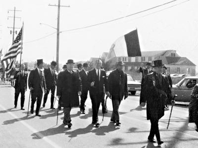 The Friends of Erin in the 1969 Montauk St. Patrick's Day Parade with Gil Keller, grand marshal, as they made their way up Edgemere Road. Below left, Mike Egan, the first grand marshal, showed how it was done in 1963. The Friends of Erin in the 1969 Montauk St. Patrick's Day Parade with Gil Keller, grand marshal, as they made their way up Edgemere Road. Below left, Mike Egan, the first grand marshal, showed how it was done in 1963.