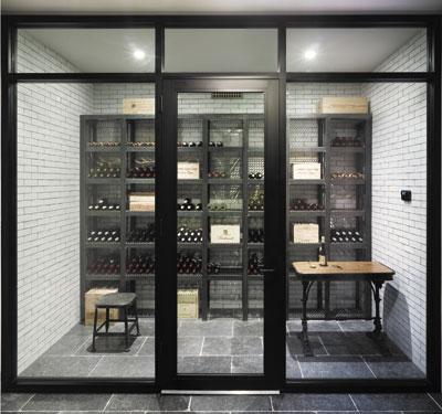 In a house he designed and built on Further Lane in East Hampton Village, Dan Scotti created a wine cellar in the basement with a glass storefront, all the better to admire the wine collection. In a house he designed and built on Further Lane in East Hampton Village, Dan Scotti created a wine cellar in the basement with a glass storefront, all the better to admire the wine collection.